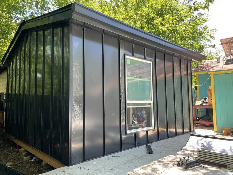 Black standing seam metal wall panels for Roof Inspection in Dinuba